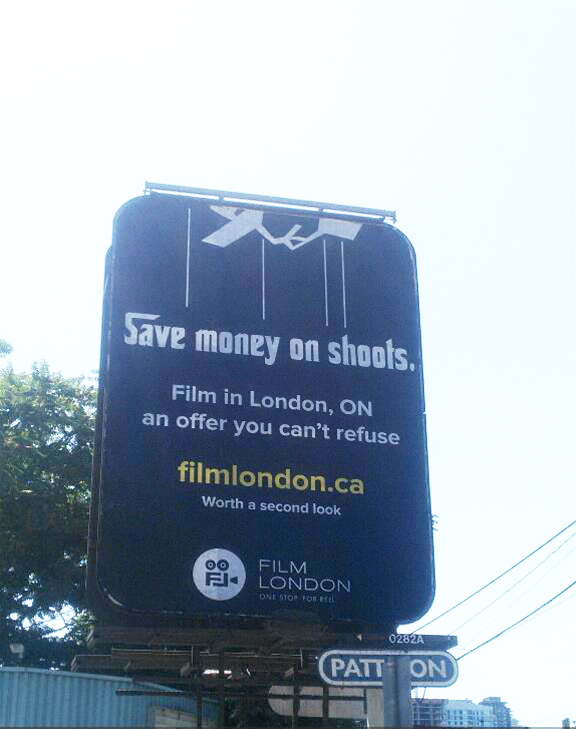 Save money on shoots poster on a billboard in Toronto near the film district